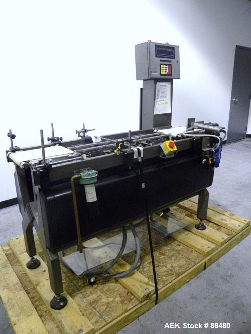 Used Hi-Speed Checkweigher, Model MM. Conveyor consists of8" wide x 12" long belt infeed, adjustable width plastic silent chain 9"L stationary, 10" long load cell and 14" wide staionary, 8" wide x 12...