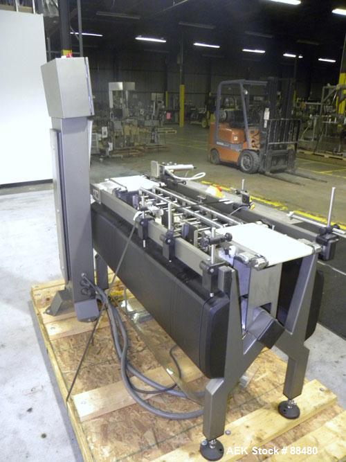 Used Hi-Speed Checkweigher, Model MM. Conveyor consists of8" wide x 12" long belt infeed, adjustable width plastic silent chain 9"L stationary, 10" long load cell and 14" wide staionary, 8" wide x 12...