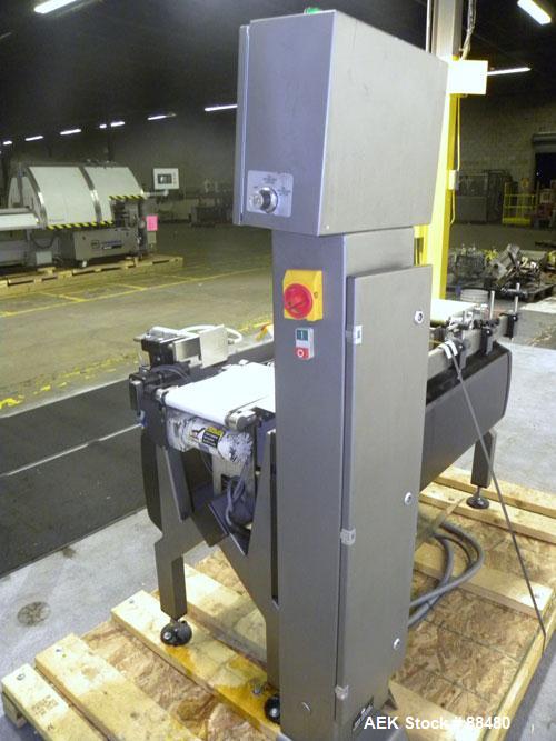 Used Hi-Speed Checkweigher, Model MM. Conveyor consists of8" wide x 12" long belt infeed, adjustable width plastic silent chain 9"L stationary, 10" long load cell and 14" wide staionary, 8" wide x 12...