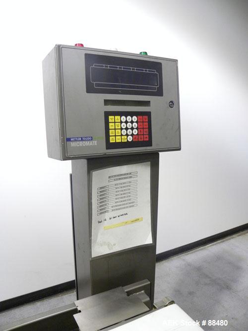 Used Hi-Speed Checkweigher, Model MM. Conveyor consists of8" wide x 12" long belt infeed, adjustable width plastic silent chain 9"L stationary, 10" long load cell and 14" wide staionary, 8" wide x 12...