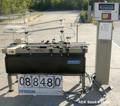 Used Hi-Speed Checkweigher, Model MM. Conveyor consists of8" wide x 12" long belt infeed, adjustable width plastic silent chain 9"L stationary, 10" long load cell and 14" wide staionary, 8" wide x 12...