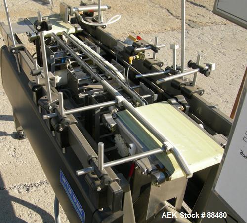 Used Hi-Speed Checkweigher, Model MM. Conveyor consists of8" wide x 12" long belt infeed, adjustable width plastic silent chain 9"L stationary, 10" long load cell and 14" wide staionary, 8" wide x 12...
