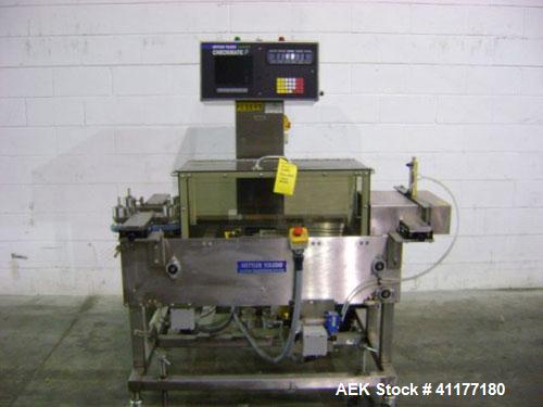 Used Hi-Speed Mettler Toledo Checkweigher, Model CM6400WD-CM. Stainless steel. Side belt driven infeed, and discharge. Approximate 36’’ chain weigh section, weight range up to 20 pounds. Capable of s...