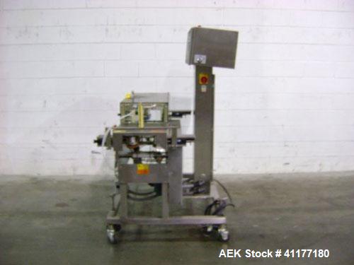 Used Hi-Speed Mettler Toledo Checkweigher, Model CM6400WD-CM. Stainless steel. Side belt driven infeed, and discharge. Approximate 36’’ chain weigh section, weight range up to 20 pounds. Capable of s...