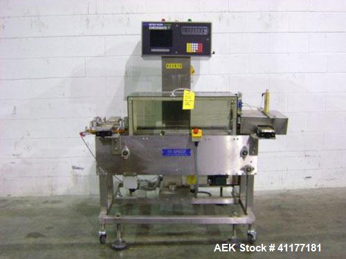 Used Hi-Speed Mettler Toledo Checkweigher, Model CM6400WD-CM. Stainless steel. Side belt driven infeed, and discharge. Approximate 36’’ chain weigh section, weight range up to 20 pounds. Capable of s...