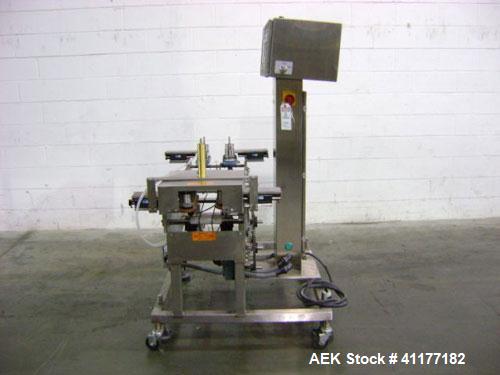 Used Hi-Speed Mettler Toledo Checkweigher, Model CM6400WD-CM. Stainless steel. Side belt driven infeed, and discharge. Approximate 36’’ chain weigh section, weight range up to 20 pounds. Capable of s...