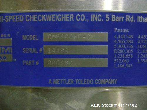 Used Hi-Speed Mettler Toledo Checkweigher, Model CM6400WD-CM. Stainless steel. Side belt driven infeed, and discharge. Approximate 36’’ chain weigh section, weight range up to 20 pounds. Capable of s...
