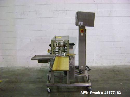 Used Hi-Speed Mettler Toledo Checkweigher, Model CM6400WD-CM. Stainless steel. Side belt driven infeed, and discharge. Approximate 36’’ chain weigh section, weight range up to 20 pounds. Capable of s...