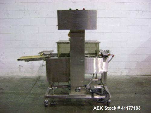 Used Hi-Speed Mettler Toledo Checkweigher, Model CM6400WD-CM. Stainless steel. Side belt driven infeed, and discharge. Approximate 36’’ chain weigh section, weight range up to 20 pounds. Capable of s...