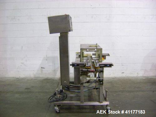 Used Hi-Speed Mettler Toledo Checkweigher, Model CM6400WD-CM. Stainless steel. Side belt driven infeed, and discharge. Approximate 36’’ chain weigh section, weight range up to 20 pounds. Capable of s...