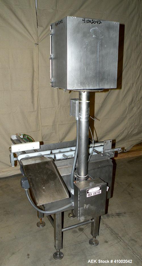 Used Whitney Packaging/Processing Corp Datachek Checkweigher, Model DC-300M. Capable of speeds up to 300 CPM and weights up to 3Kg or 6.6 lbs. Accuracies of +/- 1 gram or .5%. Left to right operation...