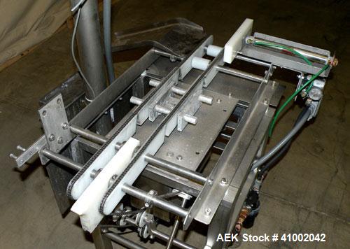 Used Whitney Packaging/Processing Corp Datachek Checkweigher, Model DC-300M. Capable of speeds up to 300 CPM and weights up to 3Kg or 6.6 lbs. Accuracies of +/- 1 gram or .5%. Left to right operation...