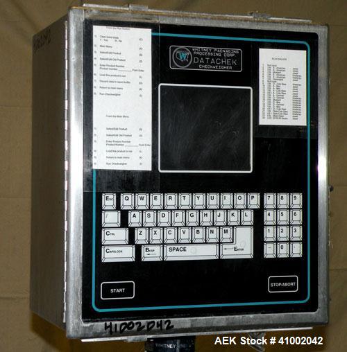 Used Whitney Packaging/Processing Corp Datachek Checkweigher, Model DC-300M. Capable of speeds up to 300 CPM and weights up to 3Kg or 6.6 lbs. Accuracies of +/- 1 gram or .5%. Left to right operation...