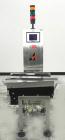 Used Alpha (All-Fill) Model CW-10 Checkweigher. Capable of speeds up to 300 packages per minute. Can handle package weights up to 10 lbs with dimensions up to 15