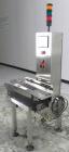 Used Alpha (All-Fill) Model CW-10 Checkweigher. Capable of speeds up to 300 packages per minute. Can handle package weights up to 10 lbs with dimensions up to 15
