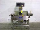 Used Hi-Speed Mettler Toledo Checkweigher, Model CM6400WD-CM. Stainless steel. Side belt driven infeed, and discharge. Approximate 36’’ chain weigh section, weight range up to 20 pounds. Capable of s...
