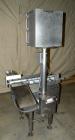 Used Whitney Packaging/Processing Corp Datachek Checkweigher, Model DC-300M. Capable of speeds up to 300 CPM and weights up to 3Kg or 6.6 lbs. Accuracies of +/- 1 gram or .5%. Left to right operation...