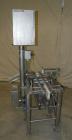 Used Whitney Packaging/Processing Corp Datachek Checkweigher, Model DC-300M. Capable of speeds up to 300 CPM and weights up to 3Kg or 6.6 lbs. Accuracies of +/- 1 gram or .5%. Left to right operation...