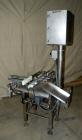 Used Whitney Packaging/Processing Corp Datachek Checkweigher, Model DC-300M. Capable of speeds up to 300 CPM and weights up to 3Kg or 6.6 lbs. Accuracies of +/- 1 gram or .5%. Left to right operation...