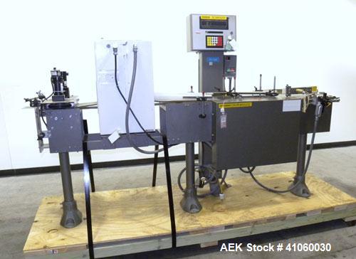 Used Mettler-Toledo Hi-Speed Checkweigher / Metal Detector combination, , Model CM60MM-BT, Serial #10518. Capacity 50 pounds, last running 1661 gram containers at 20 to 60 pieces per minute. (2) Sile...