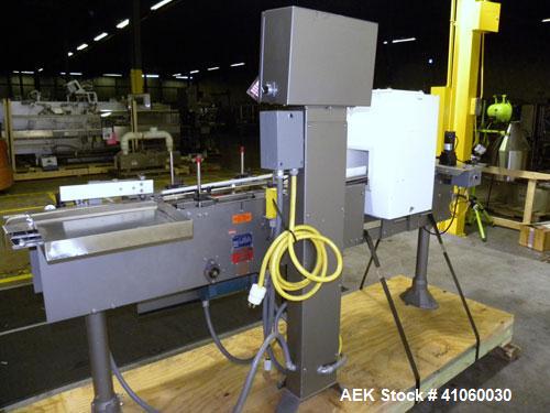 Used Mettler-Toledo Hi-Speed Checkweigher / Metal Detector combination, , Model CM60MM-BT, Serial #10518. Capacity 50 pounds, last running 1661 gram containers at 20 to 60 pieces per minute. (2) Sile...