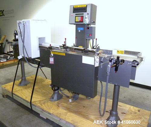 Used Mettler-Toledo Hi-Speed Checkweigher / Metal Detector combination, , Model CM60MM-BT, Serial #10518. Capacity 50 pounds, last running 1661 gram containers at 20 to 60 pieces per minute. (2) Sile...