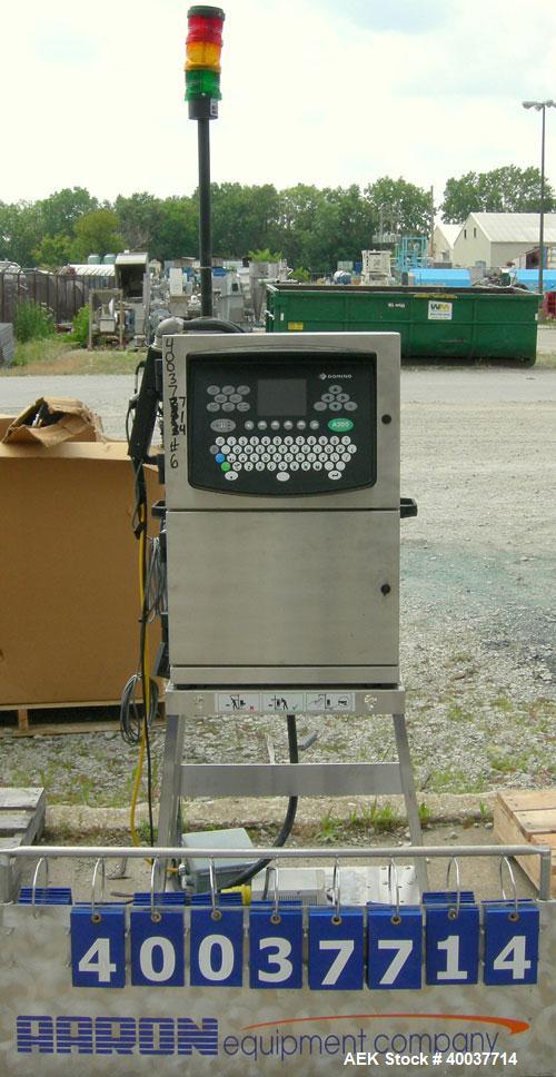 Used Domino A200 Small Character Ink Jet Coder, Model A200. Can print up to four lines of type with a variety of print formats including Logos, bar codes, automatic serial numbering/batch coding. Hig...