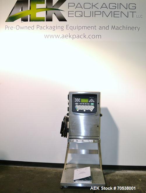 Unused- Domino A200 Small Character Ink Jet Coder, Model A200. Can print up to four lines of type with a variety of print formats including logos, bar codes, automatic serial numbering/batch coding. ...