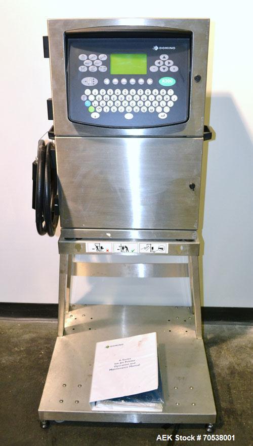 Unused- Domino A200 Small Character Ink Jet Coder, Model A200. Can print up to four lines of type with a variety of print formats including logos, bar codes, automatic serial numbering/batch coding. ...
