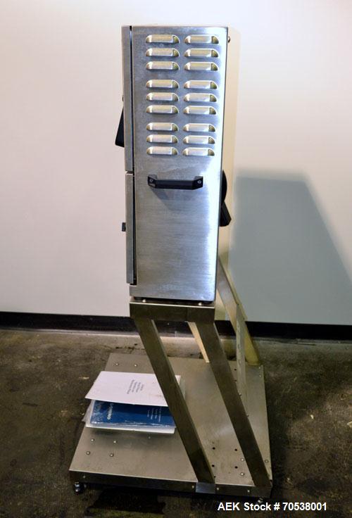 Unused- Domino A200 Small Character Ink Jet Coder, Model A200. Can print up to four lines of type with a variety of print formats including logos, bar codes, automatic serial numbering/batch coding. ...