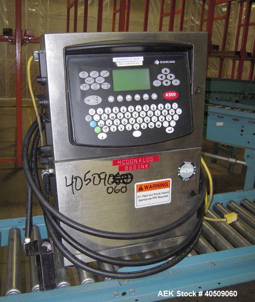 Used Domino Ink Jet Coder, Model A300. Mounted on a cart with casters.
