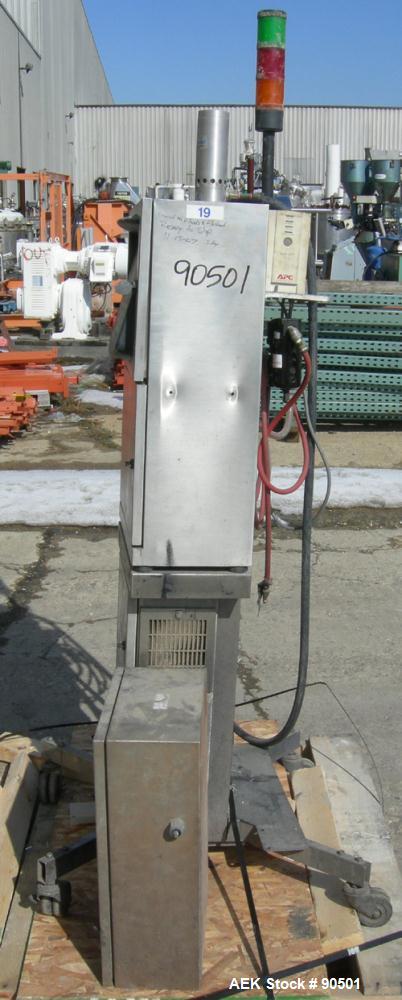 USED: Domino ink jet coder, model A300. Designed for 4 line printing in a harsh environment. Stainless steel cabinet with touch screen. Mounted on casters.