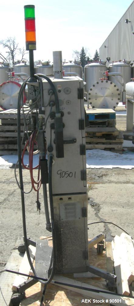 USED: Domino ink jet coder, model A300. Designed for 4 line printing in a harsh environment. Stainless steel cabinet with touch screen. Mounted on casters.