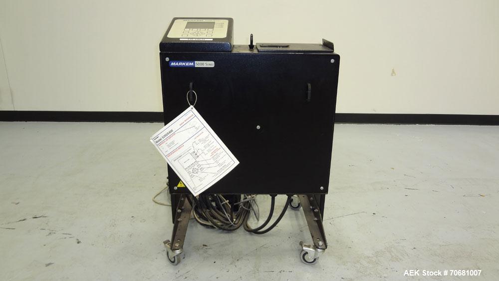 Used Markem 5000 Series Touch Dry Ink Jet Printer, Model 5200. Print area 65mm x 1200mm per printhead (2.56" x 47.25"). Print speed 55m/minute (180ft/min). Most industry standard bar codes including ...