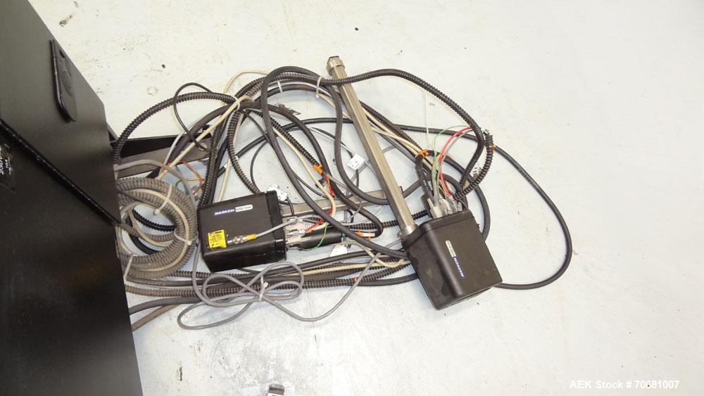 Used Markem 5000 Series Touch Dry Ink Jet Printer, Model 5200. Print area 65mm x 1200mm per printhead (2.56" x 47.25"). Print speed 55m/minute (180ft/min). Most industry standard bar codes including ...
