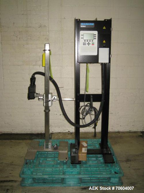 Used Markem Model 9064 Ink Jet Coder. Small character coder with print height up to 1" or 25.4 mm. Message length up to 14" or 356 mm. Stores up to 50 messages. Prints up to 8 lines of text. Printhea...