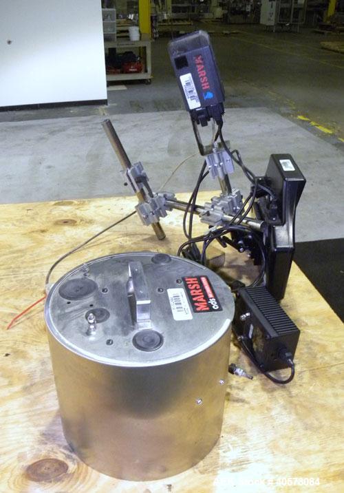 Used Marsh Ink Jet Coder, Model Patrion. Marsh key board part #27171, head #27132. Includes an AC adapter and an air drive system.