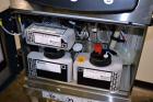 Unused- Domino A200 Small Character Ink Jet Coder, Model A200. Can print up to four lines of type with a variety of print formats including logos, bar codes, automatic serial numbering/batch coding. ...