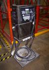 Used Domino Ink Jet Coder, Model A300. Mounted on a cart with casters.