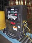 Used Domino Ink Jet Coder, Model A300. Mounted on a cart with casters.