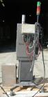 USED: Domino ink jet coder, model A300. Designed for 4 line printing in a harsh environment. Stainless steel cabinet with touch screen. Mounted on casters.