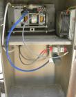 USED: Domino ink jet coder, model A300. Designed for 4 line printing in a harsh environment. Stainless steel cabinet with touch screen. Mounted on casters.