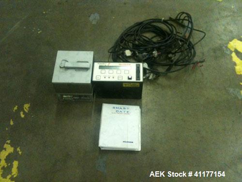 Used Markem High Speed Thermal Ribbon Continuous Left Hand feed Motion Coder, Model SmartDate 2. Prints at speeds up to 39 inches per second (typically 400 packages per minute). The SmartDate coder c...