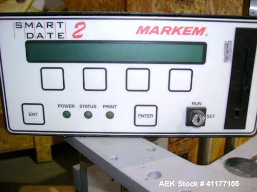 Used Markem High Speed Thermal Ribbon Continuous Left Hand Feed Motion Coder, Model SmartDate 2. Prints at speeds up to 39 inches per second (typically 400 packages per minute). The SmartDate coder c...