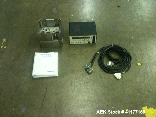 Used Markem High Speed Thermal Ribbon Continuous Left Hand Feed Motion Coder, Model SmartDate 2. Prints at speeds up to 39 inches per second (typically 400 packages per minute). The SmartDate coder c...