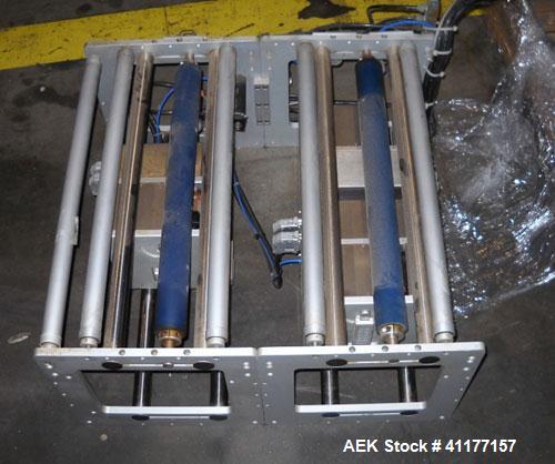 Used Markem High Speed Thermal Ribbon Continuous Left Hand Feed Motion Coder, Model SmartDate 2. Prints at speeds up to 39 inches per second (typically 400 packages per minute). The SmartDate coder c...