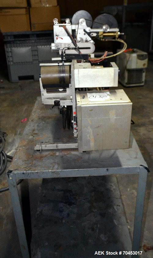 Used Norwood LIS offline stand alone label imprinting system. Capable of speeds up to 150 labels per minute. Imprint areas up to 4" x 4". Standard label reals on 3" inner coder and max 12" diam reel....