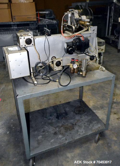 Used Norwood LIS offline stand alone label imprinting system. Capable of speeds up to 150 labels per minute. Imprint areas up to 4" x 4". Standard label reals on 3" inner coder and max 12" diam reel....