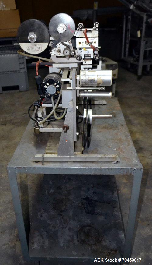 Used Norwood LIS offline stand alone label imprinting system. Capable of speeds up to 150 labels per minute. Imprint areas up to 4" x 4". Standard label reals on 3" inner coder and max 12" diam reel....