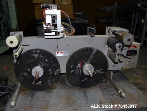 Used Norwood LIS offline stand alone label imprinting system. Capable of speeds up to 150 labels per minute. Imprint areas up to 4" x 4". Standard label reals on 3" inner coder and max 12" diam reel....
